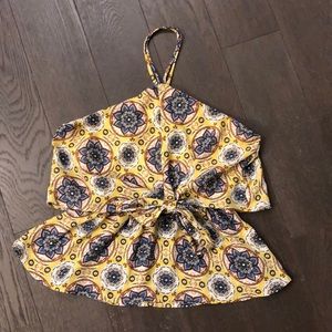 Yellow sleeveless top with blue flowers